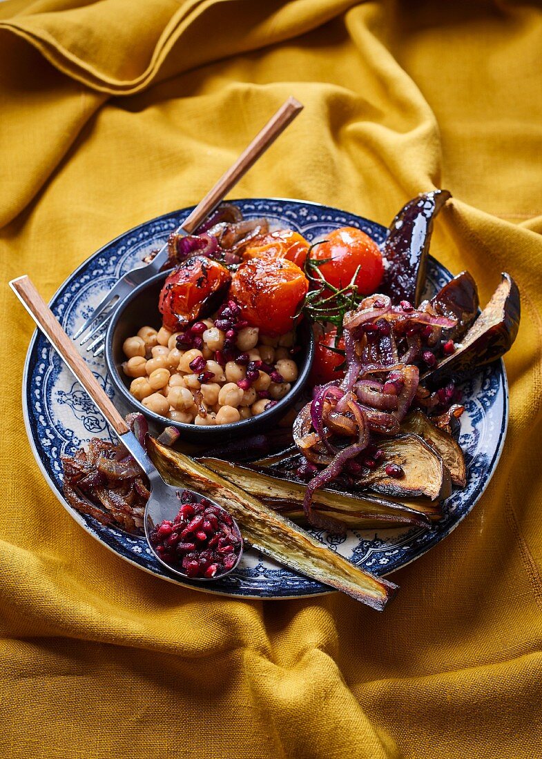 Chickpeas with fried aubergine, caramelised onion and dried pomegranate seeds