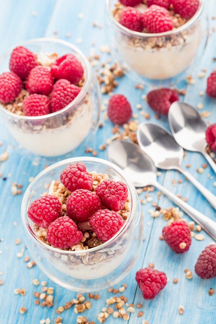 Breakfast with muesli, yogurt and fresh raspberries