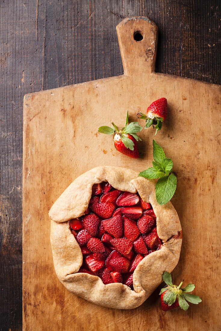 Strawberry pie on wooden background