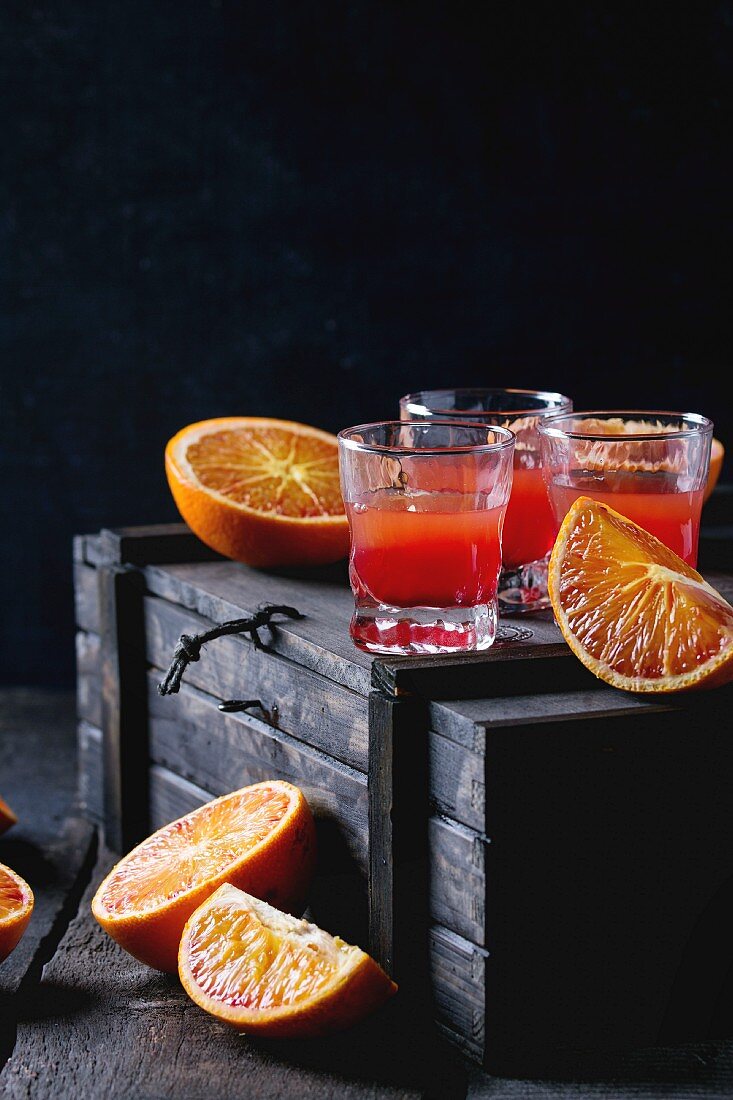 Shorts of alcohol cocktail with Sliced Sicilian Blood oranges and fresh red orange juice