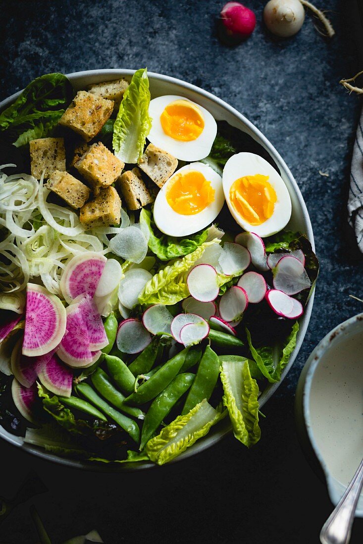 Spring greens salad with fennel, radish and miso-buttermilk dressing