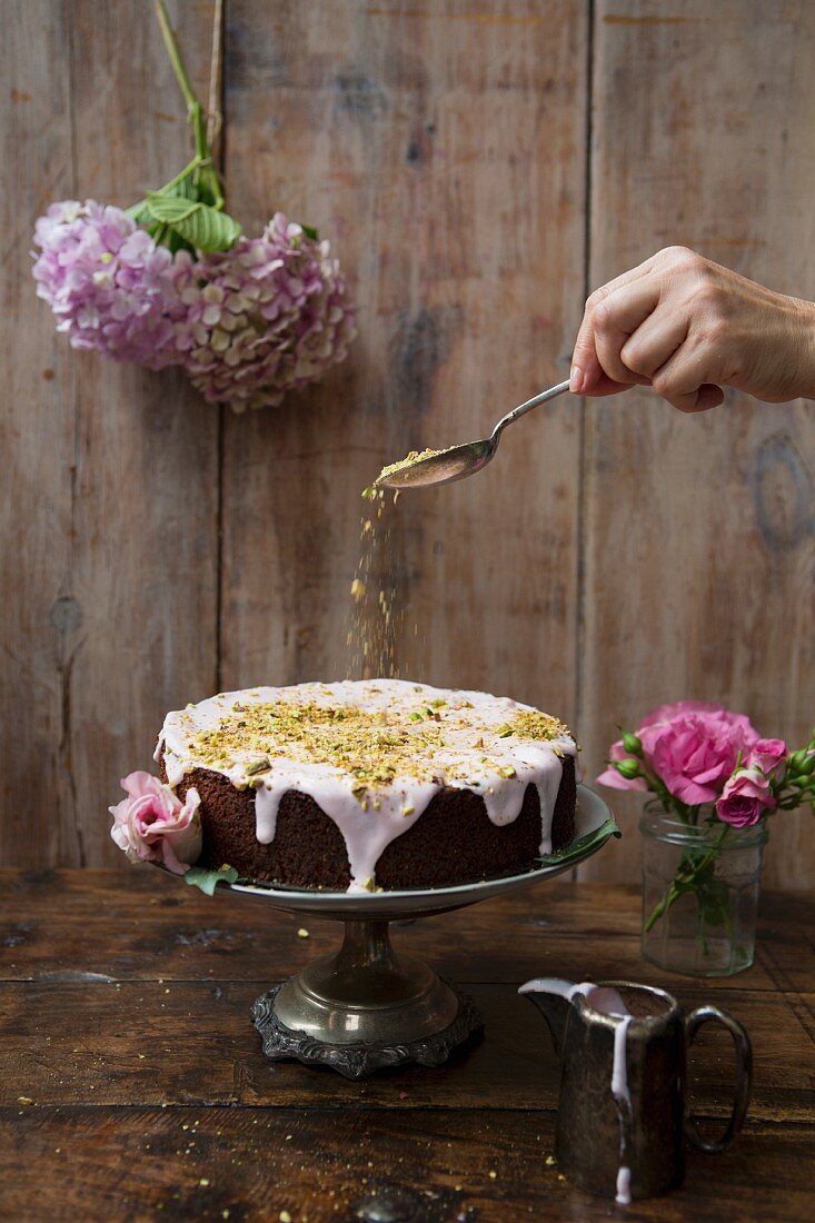 Pistachio and Rose Cake with Hand Sprinkling Nuts