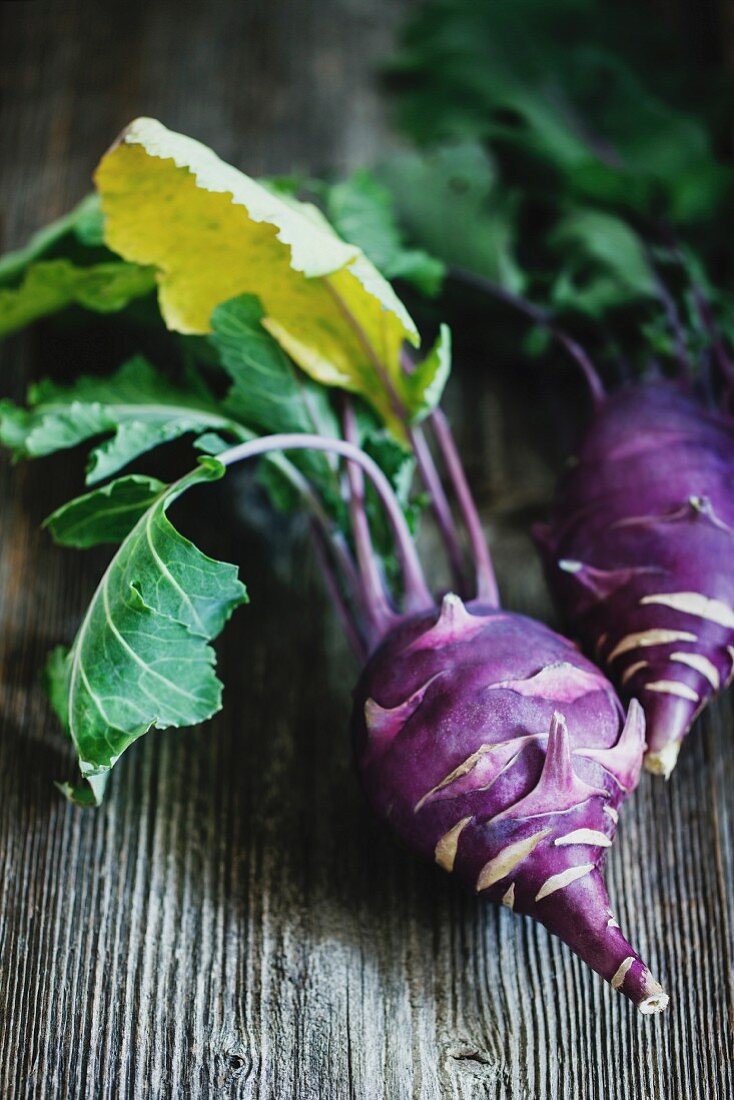 Kohlrabi cabbage on dark wooden background