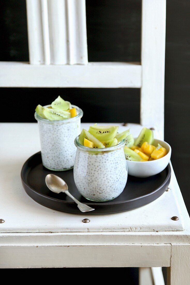 Kiwi, mango and chia seeds pudding in jar for breakfast