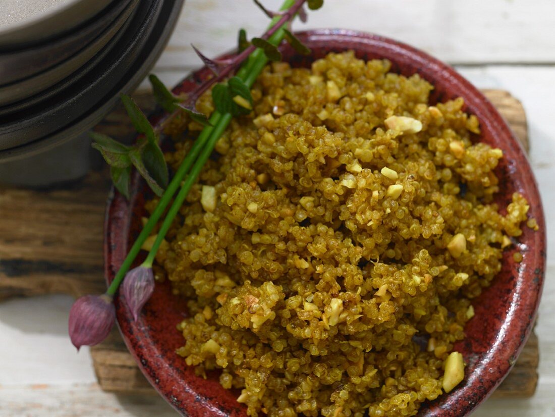 Fried quinoa with curry and almonds