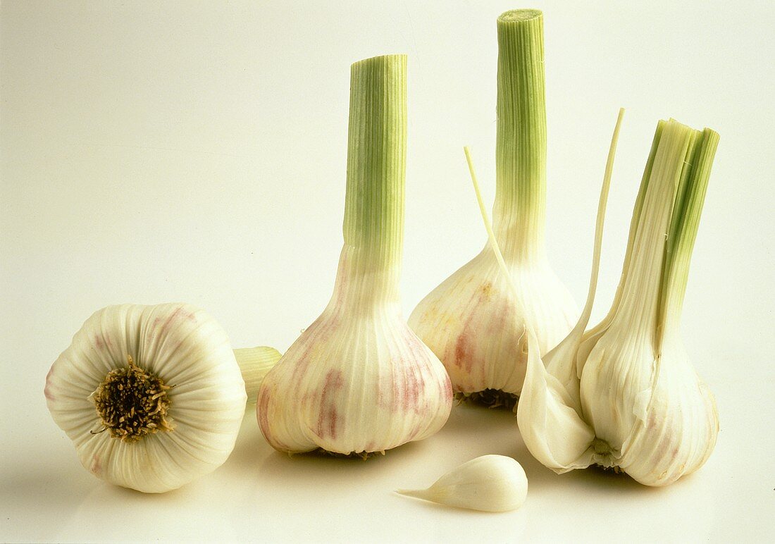 Three Whole Garlic Bulbs and One with Cloves