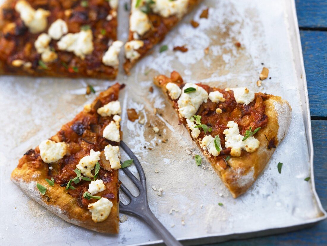 Pizza with spicy eggplant ragout and goat's cheese
