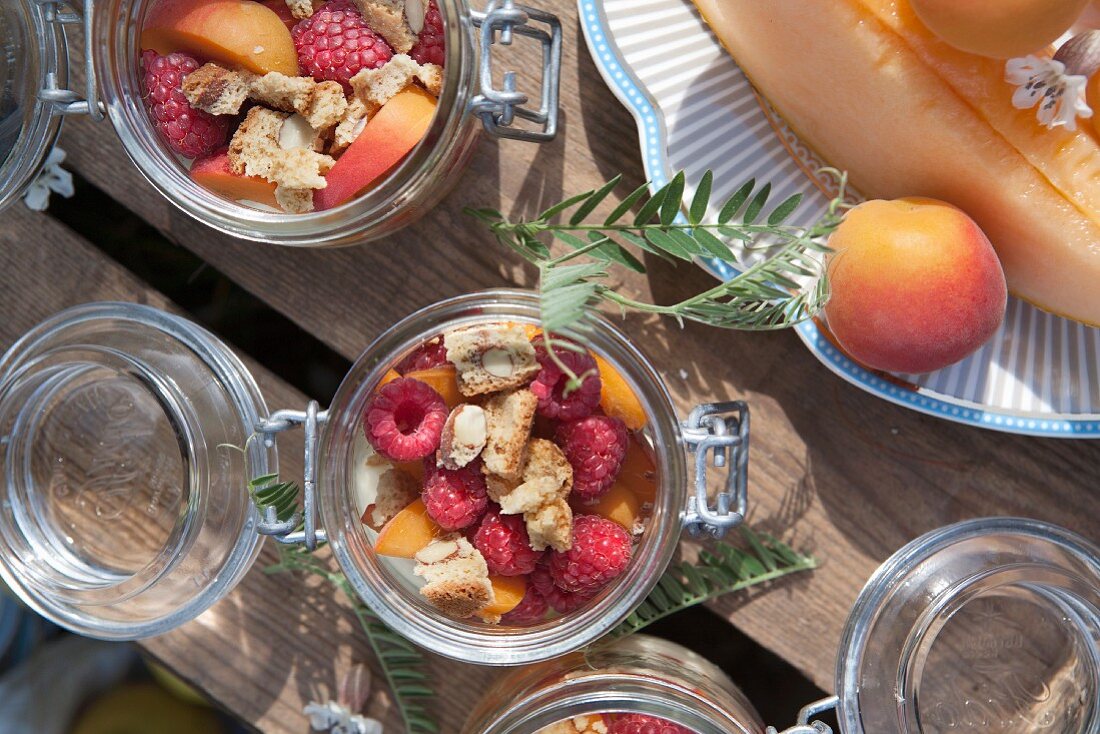 Desserts in glass jars, nectarine and melon