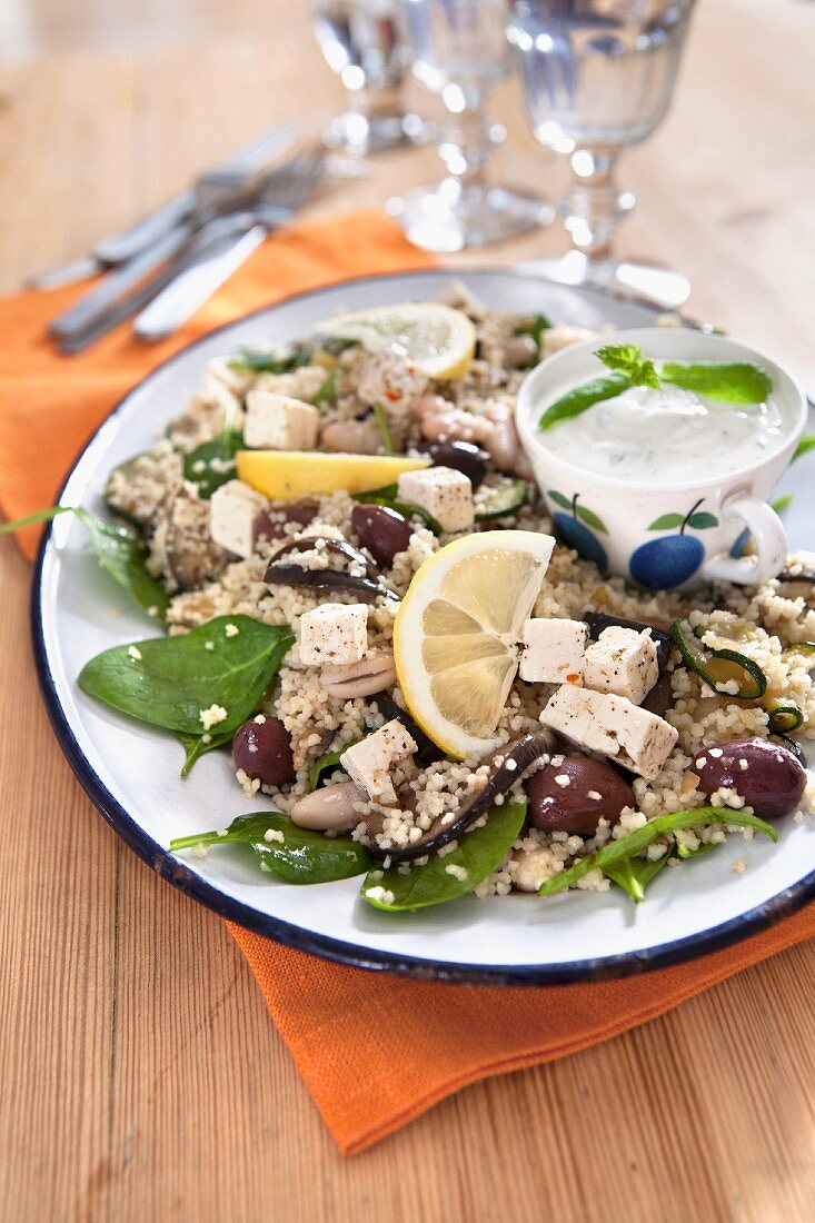 Couscous salad with olives, lemon, feta, aubergine and yoghurt dressing