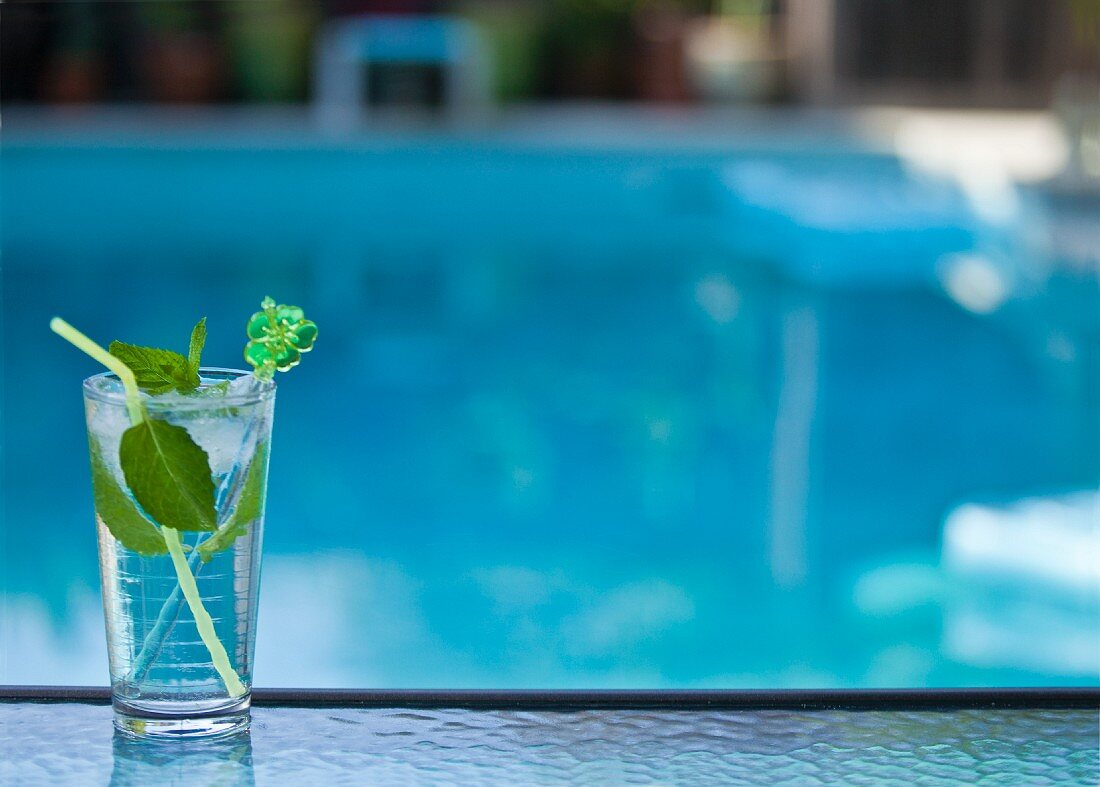 Mojito cocktail by swimming pool