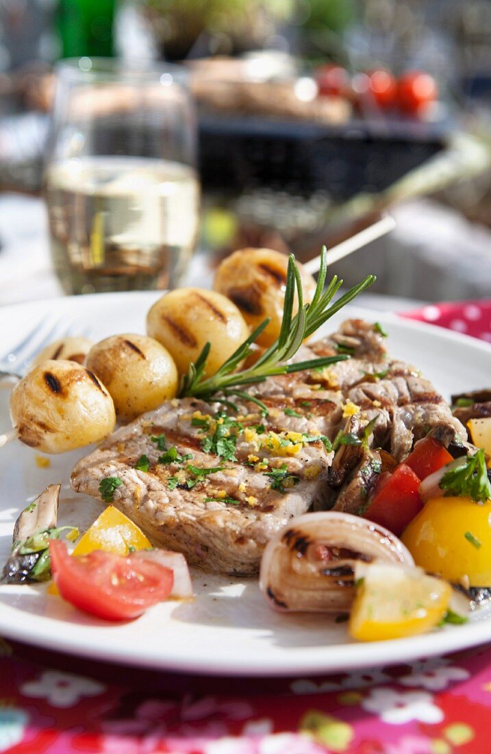 Grilled meat, potatoes and vegetables