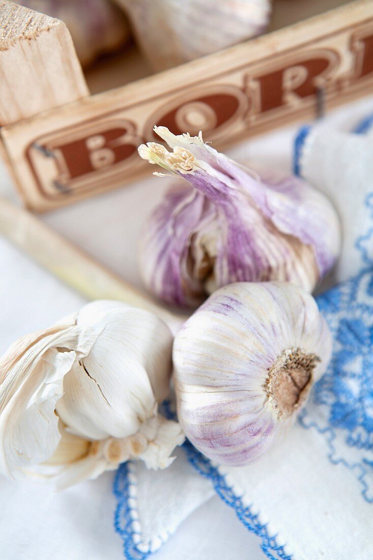 Garlic in front of a wooden crate