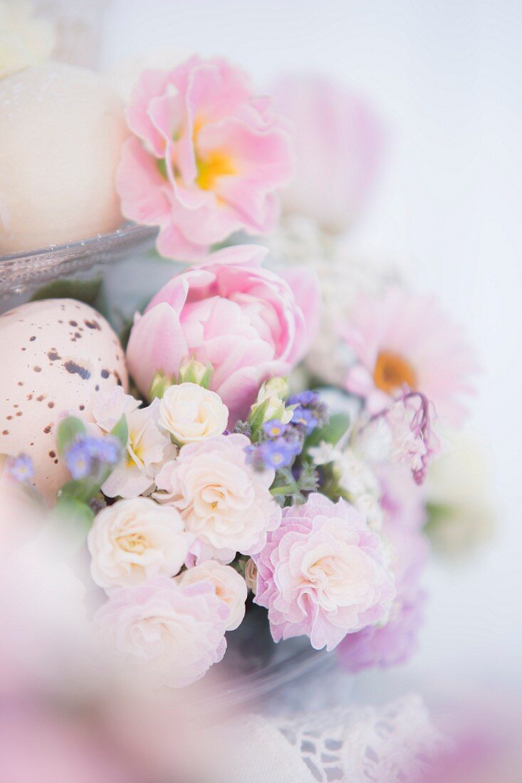 Easter flower arrangement with speckled egg