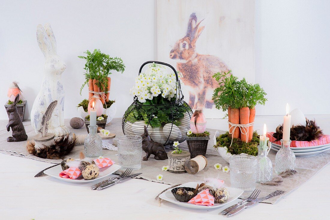 Decorative flower arrangements and rabbit figurines on festively set Easter table