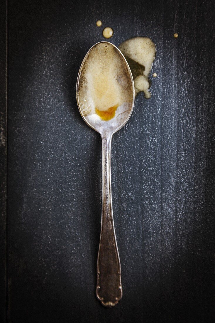 Beer foam on a silver spoon