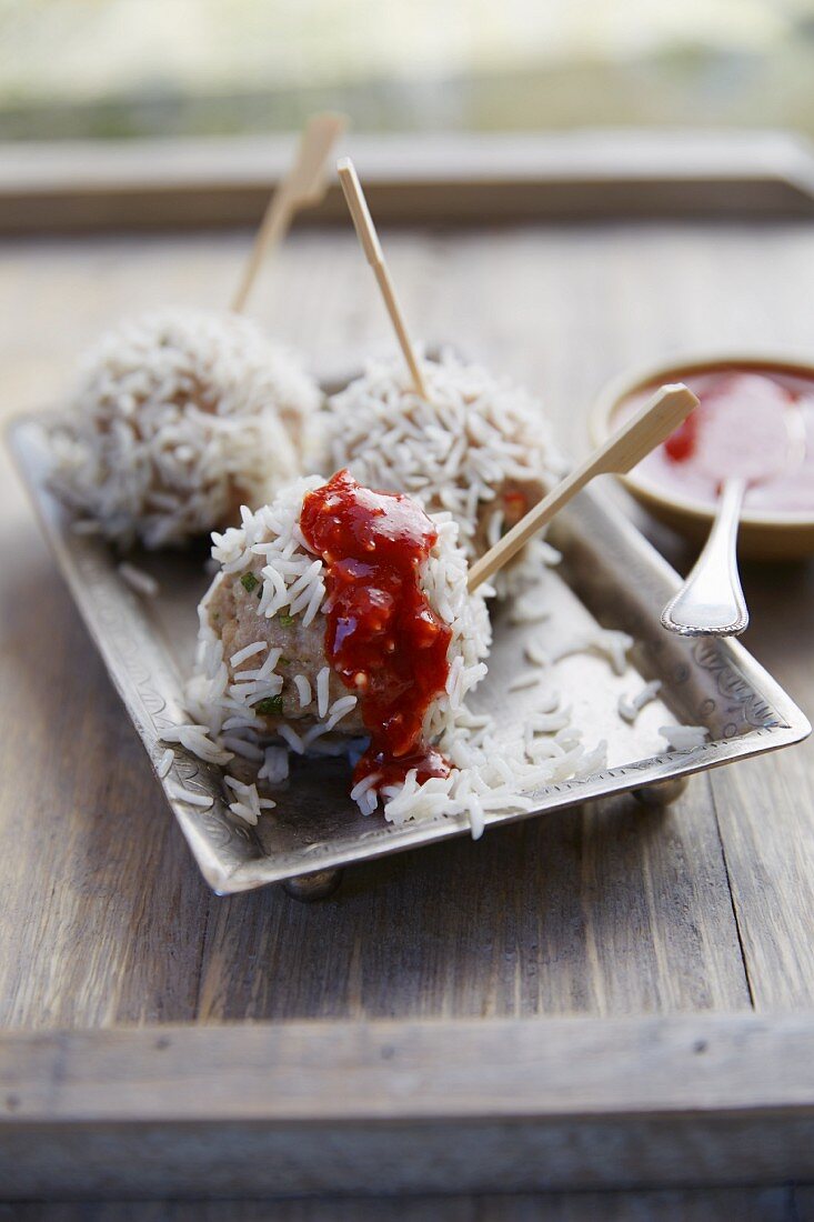 Meatballs in rice with tomato sauce