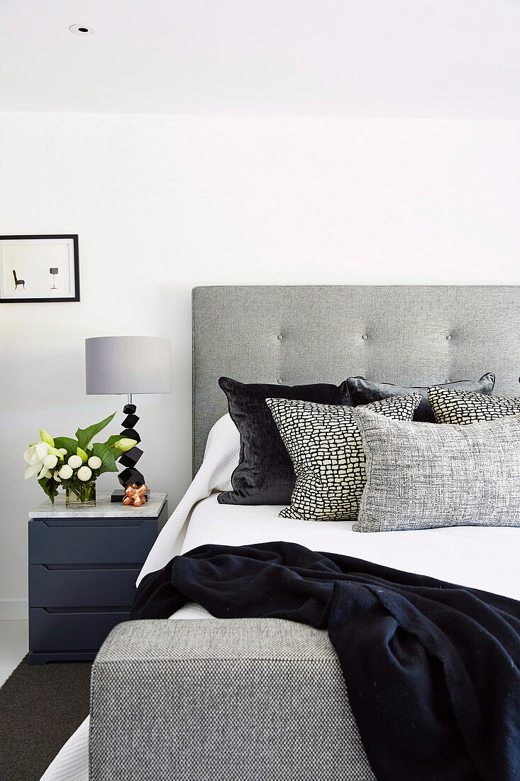 Modern upholstered bed in shades of gray