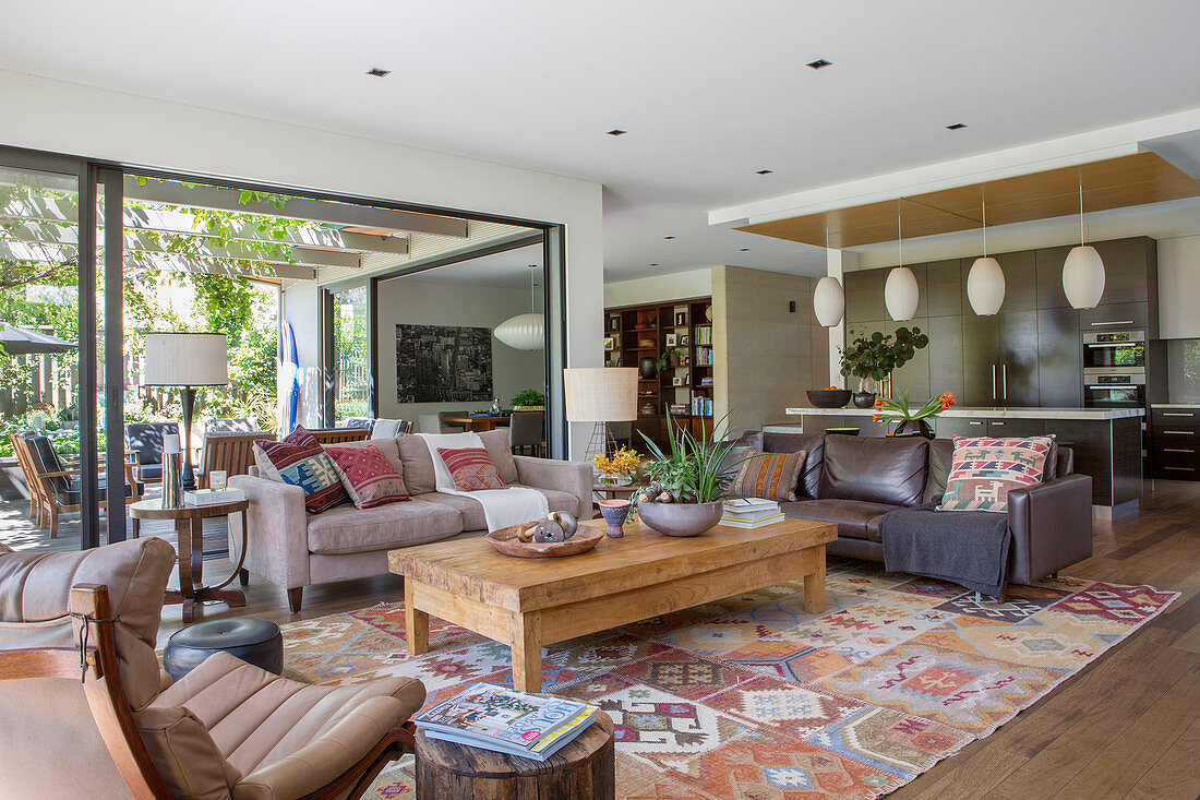 Open living room in natural tones with a window facing the garden