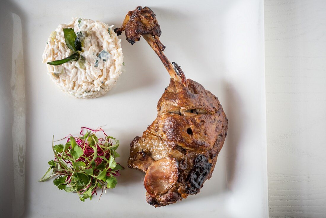 Confit of Duck Leg with curd rice and salad