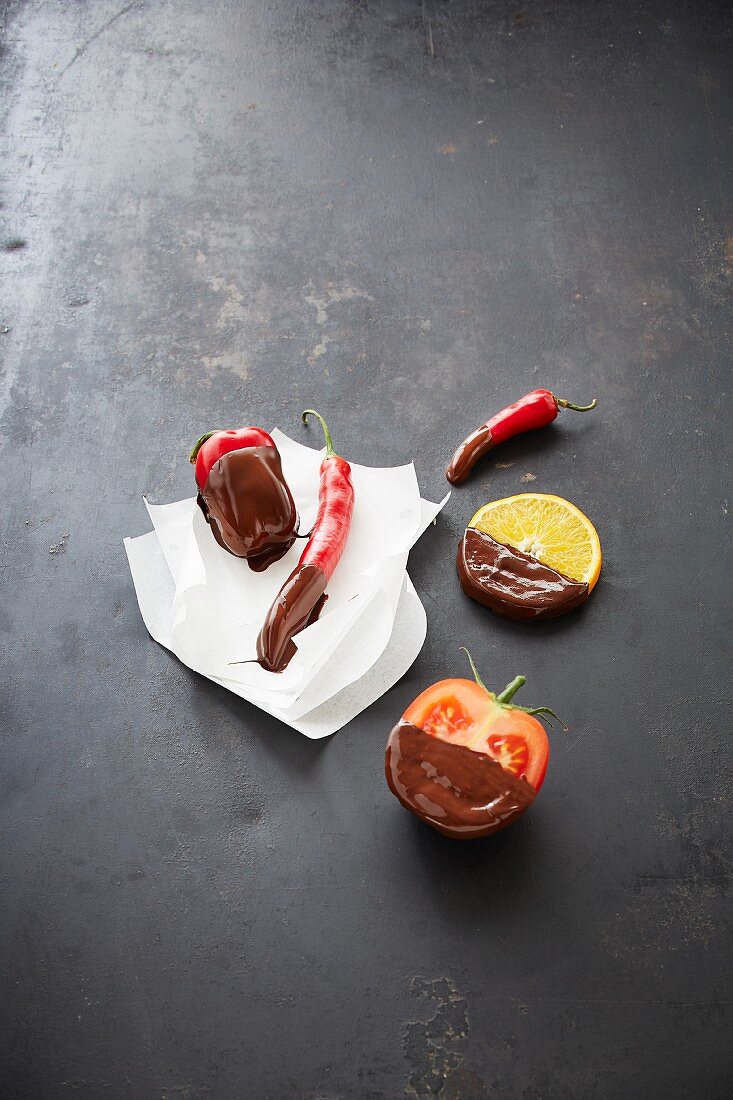 Fruits, chillli and tomatoes with a chocolate glaze