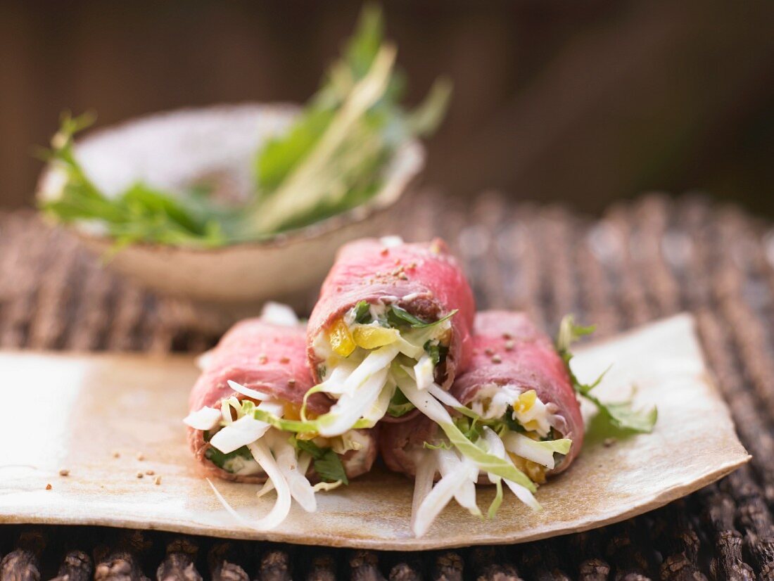 Roast beef rolls with pumpkin and bok choy