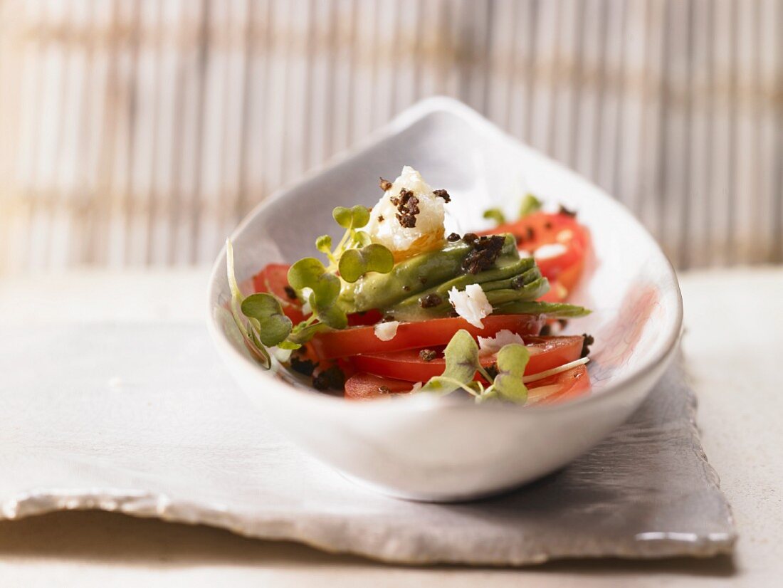 Avocado and tomato salad with smoked halibut