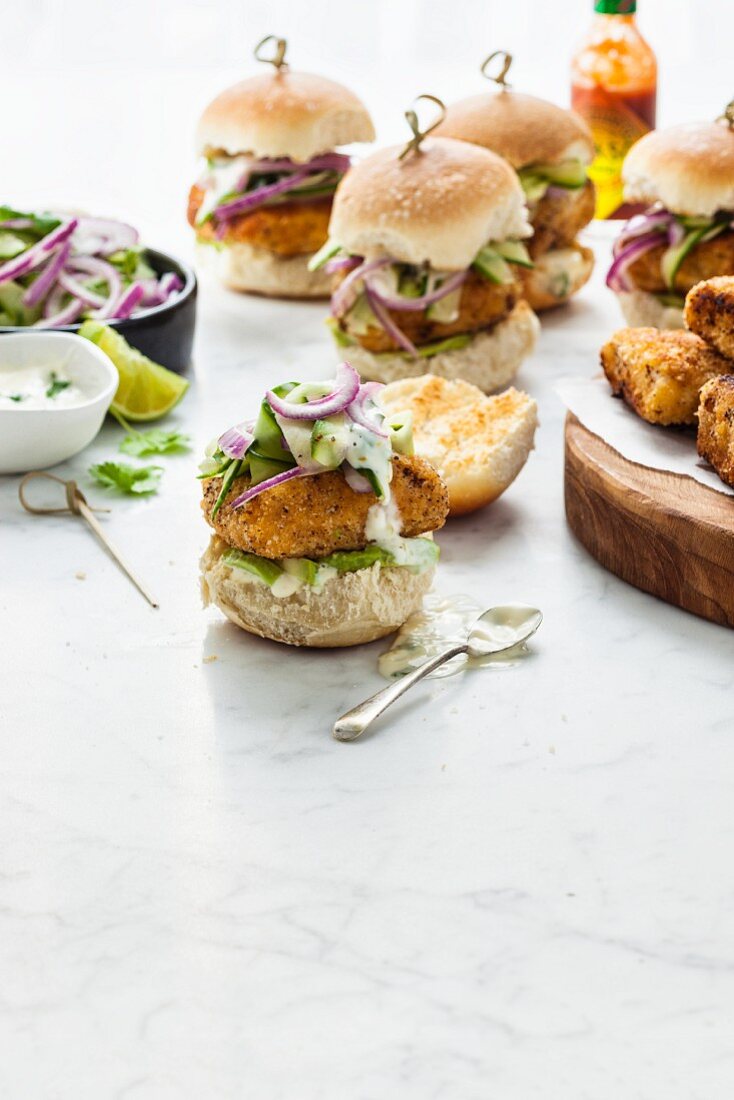 Fish Sliders with pickled cucumber and red onion