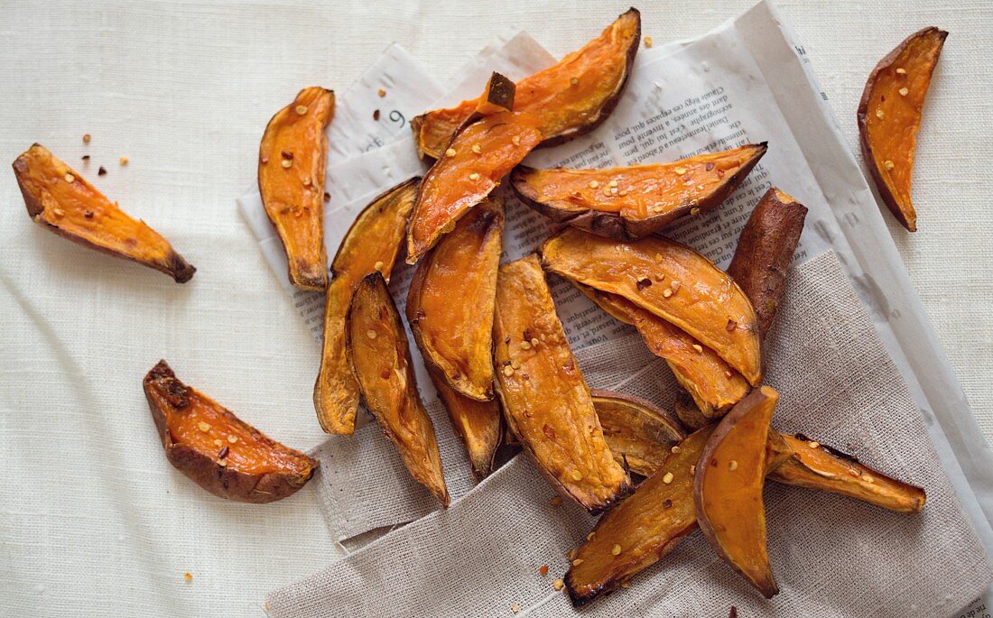 Top view scattering of sweet potato wedges with Chilli