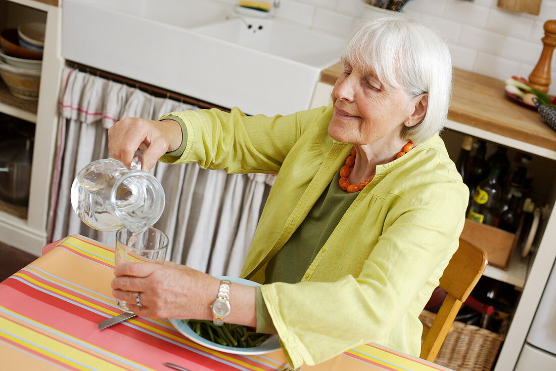 Elderly woman drinking