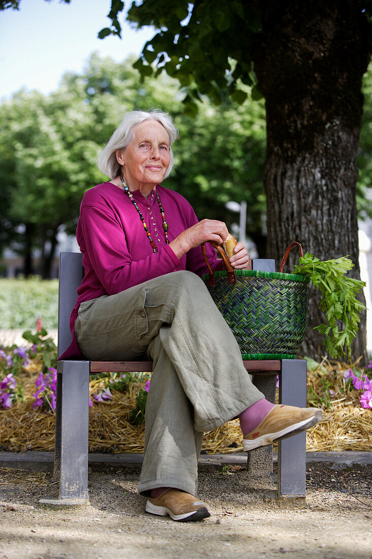 Elderly woman on a bench