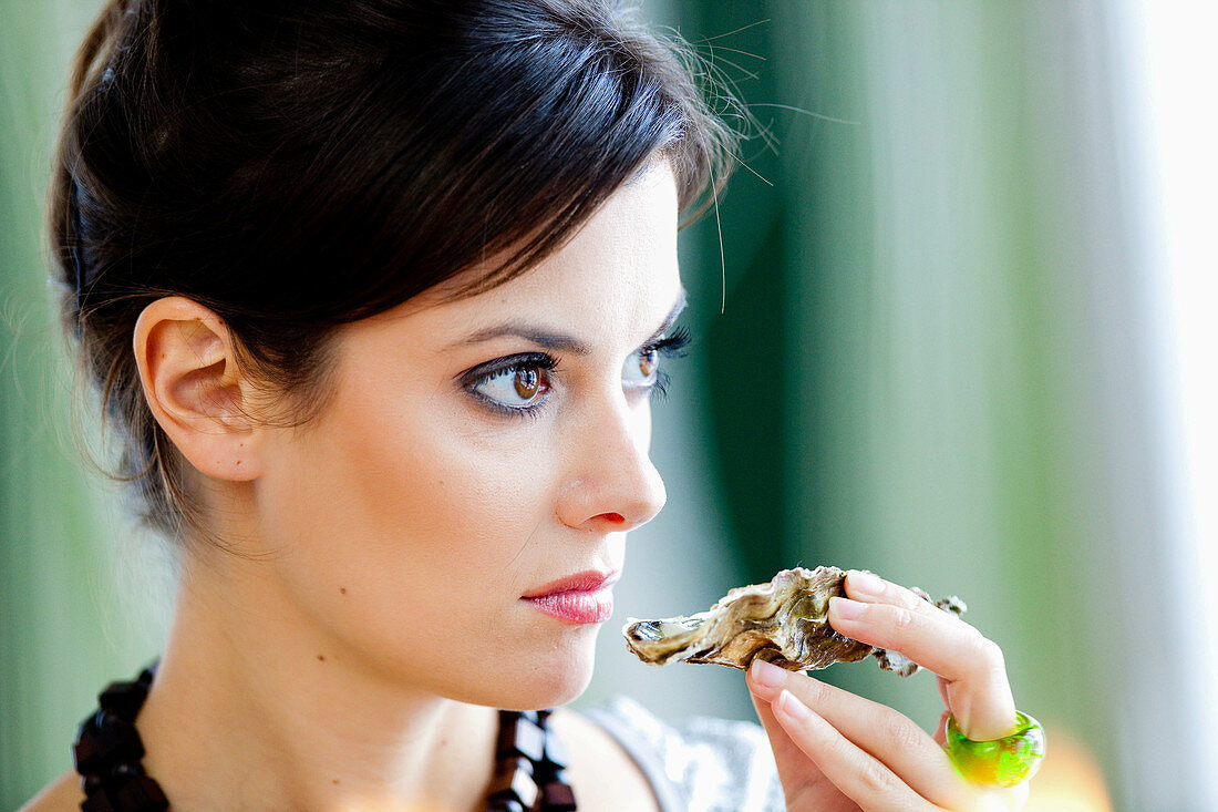 Woman smelling rotten oyster