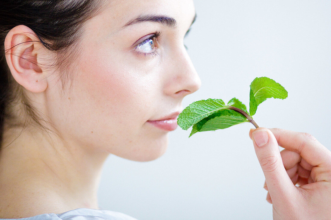 Woman smelling mint