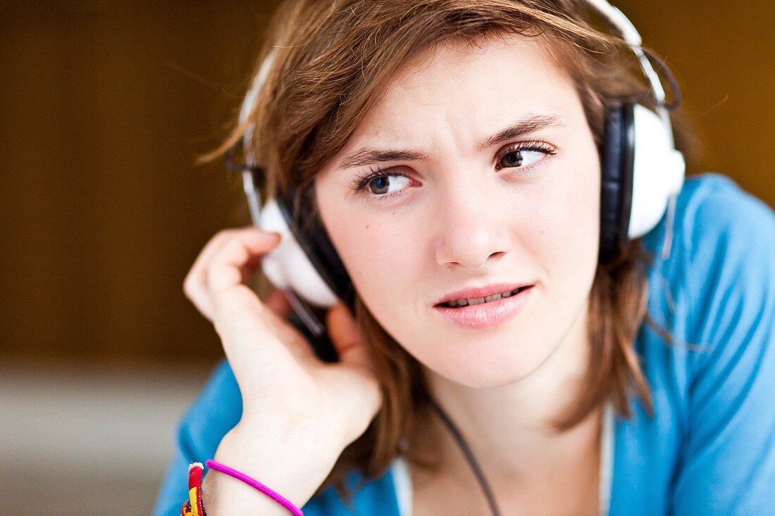 Teenage girl listening to music