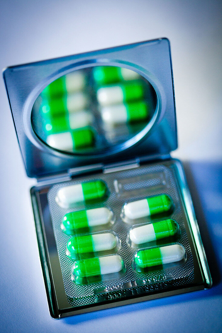 Drug capsules on mirror