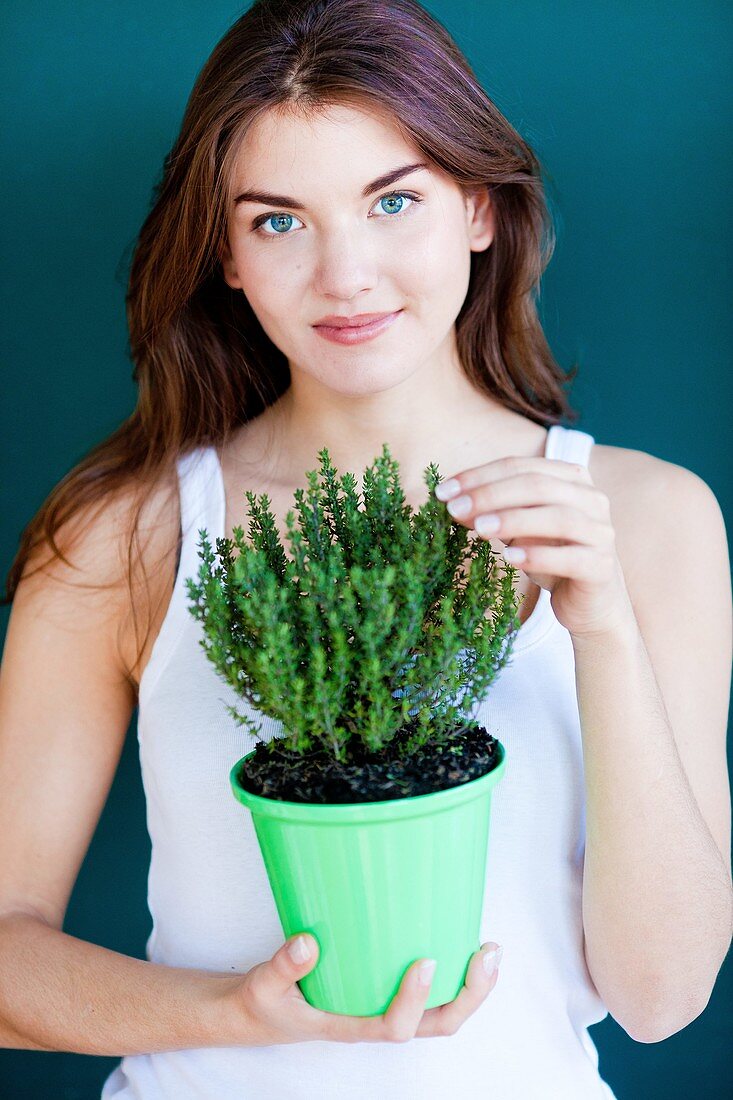 Woman inhaling thyme fragrance