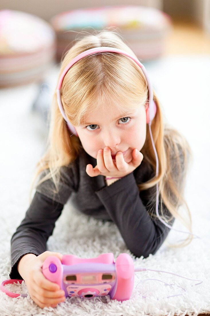 6 year old girl listening to music