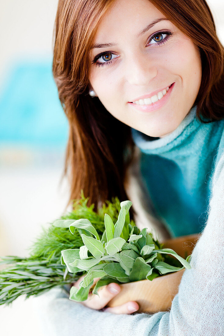 Woman holding herbs
