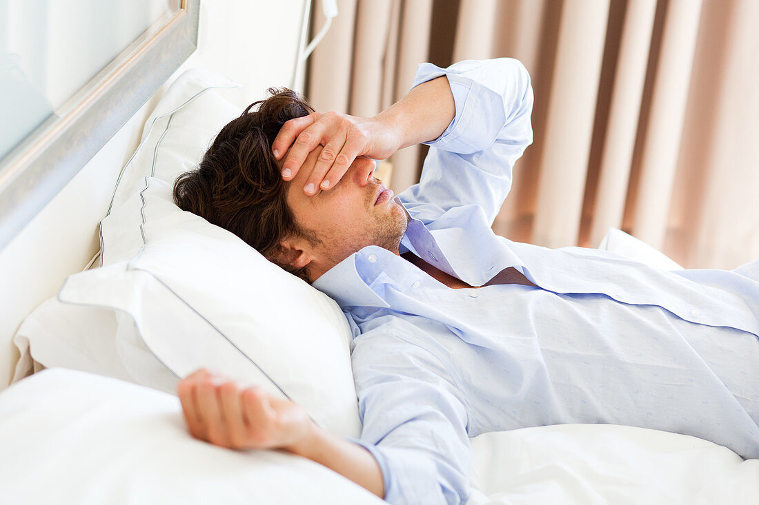 Man relaxing on bed