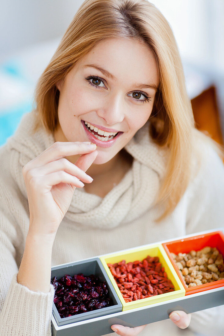 Woman eating dried berries