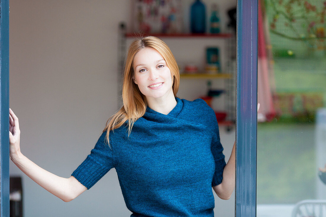 Woman opening French window