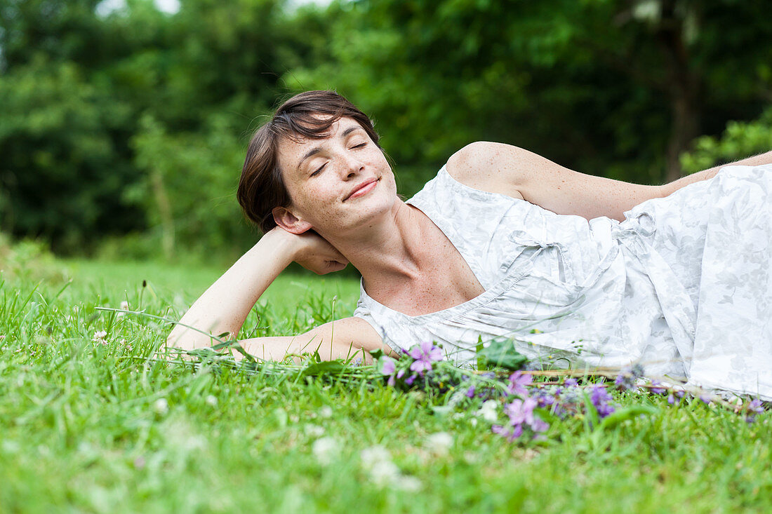 Woman relaxing on grass