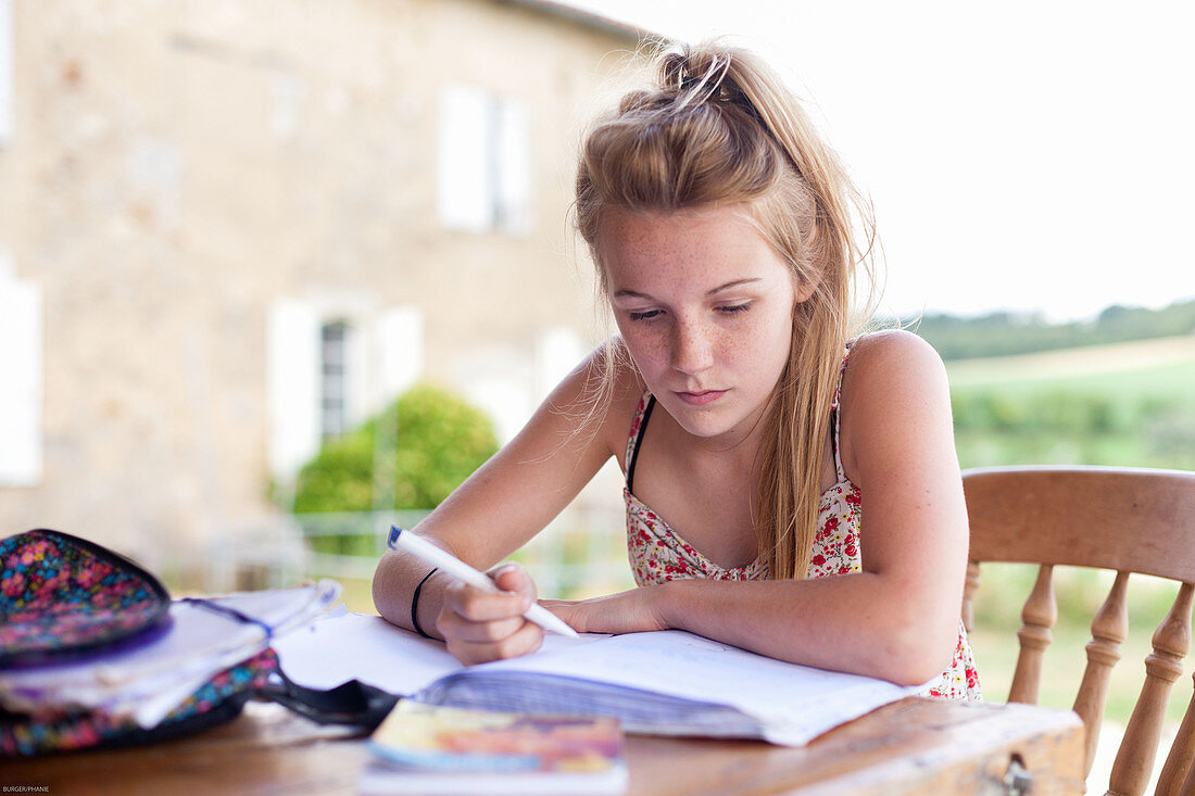 Teenager writing