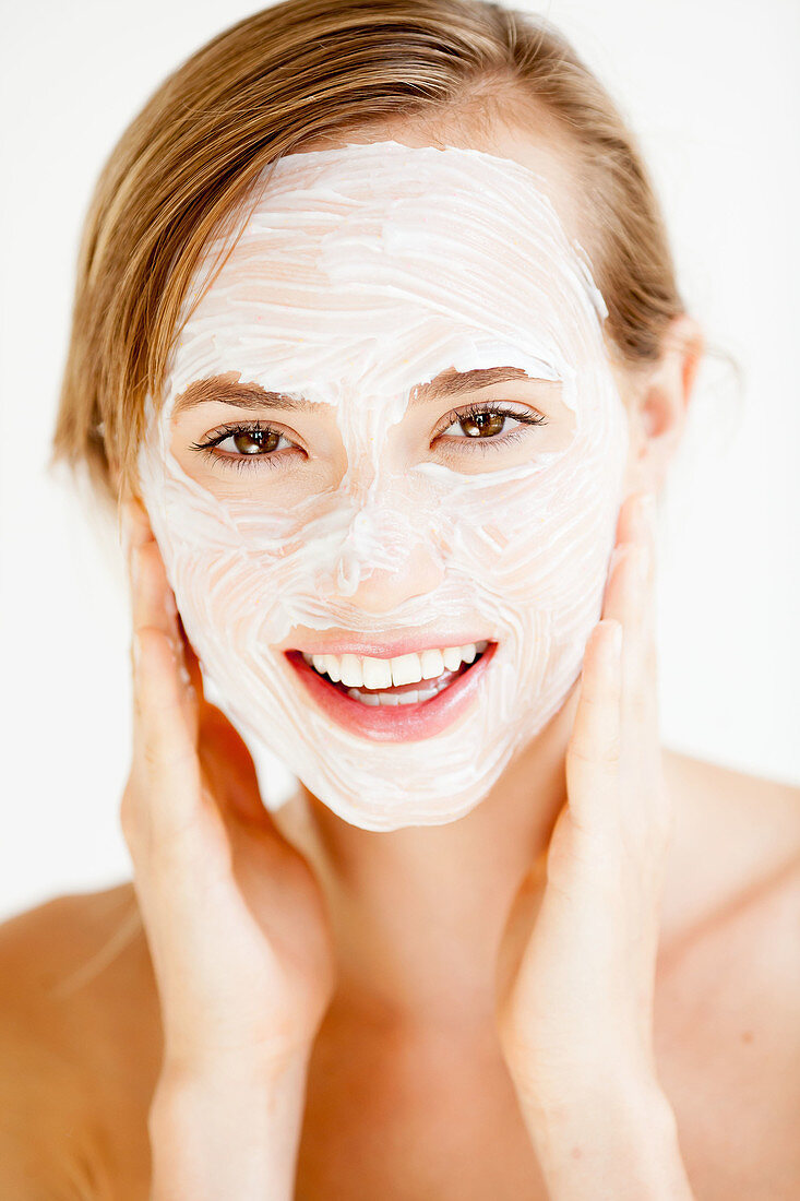 Woman with cosmetic beauty mask