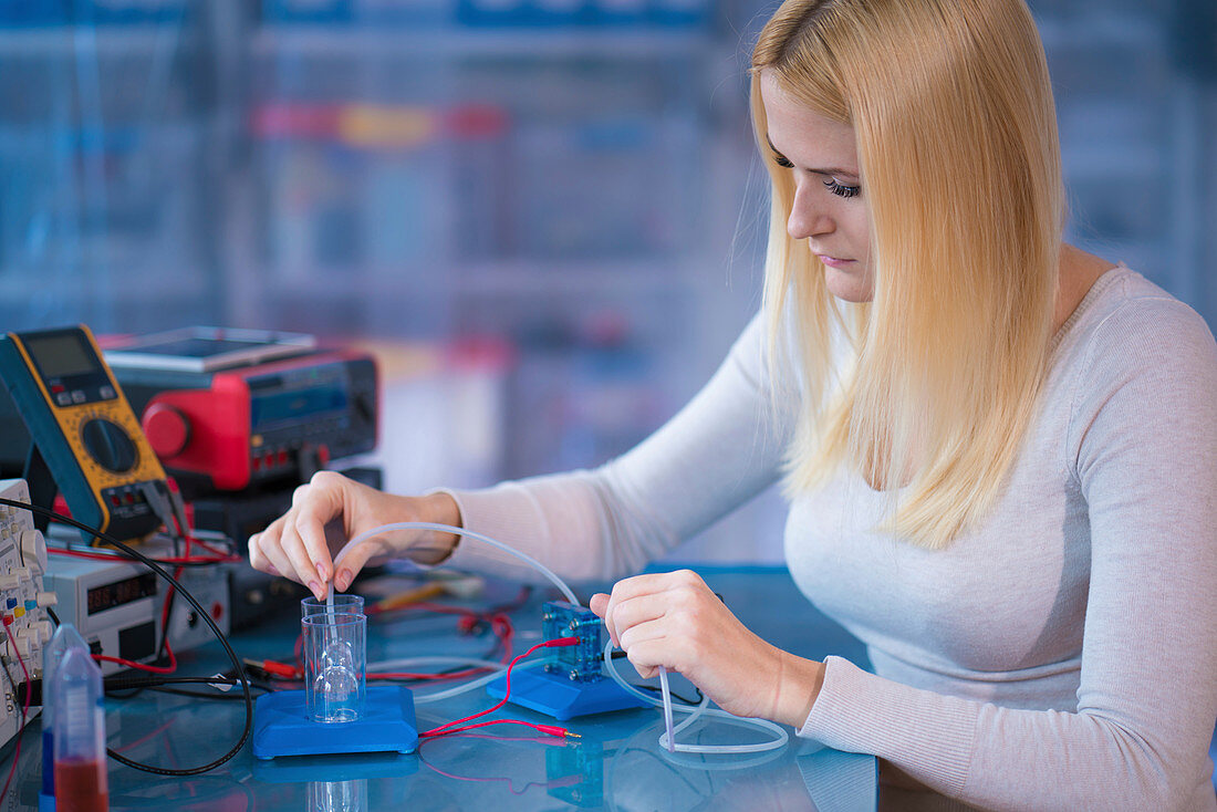 Woman experimenting with fuel cell