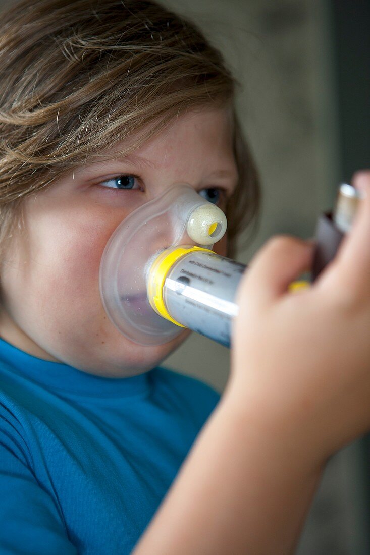 Child using asthma inhaler