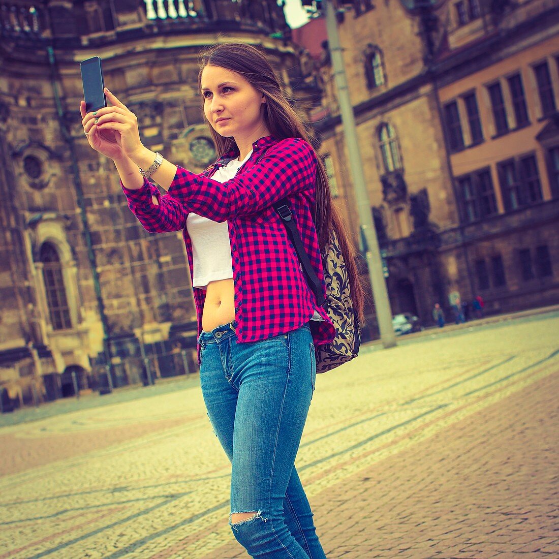Young woman taking photo of herself