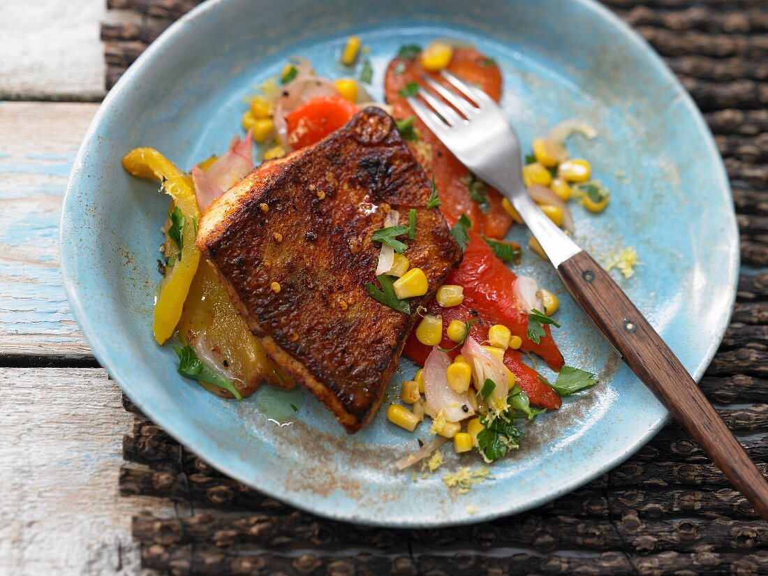 A sharp zander fillet with peppers and corn