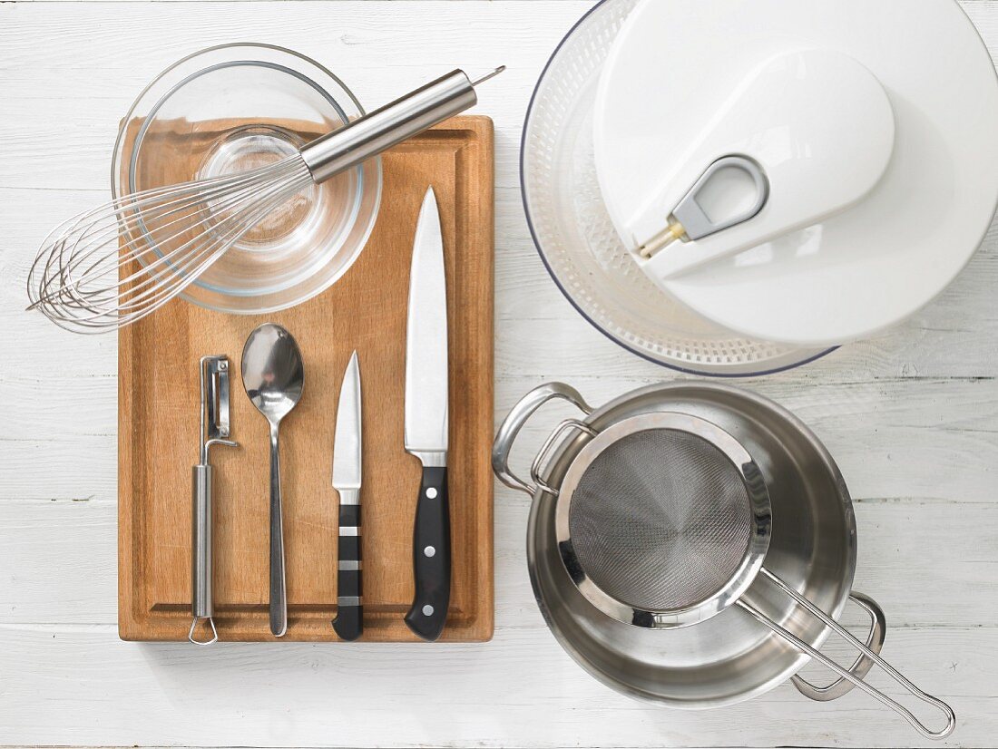 Kitchen utensils for making a seafood salad with vegetables