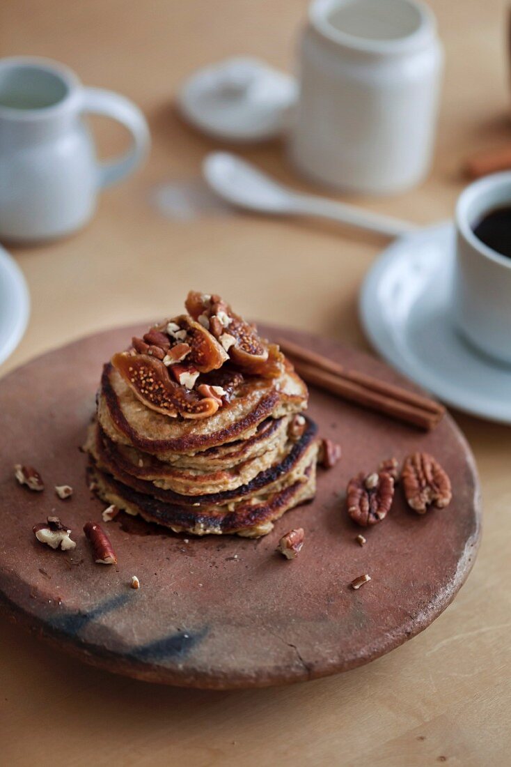 Banana oats healthy pancakes and coffee on the wooden table