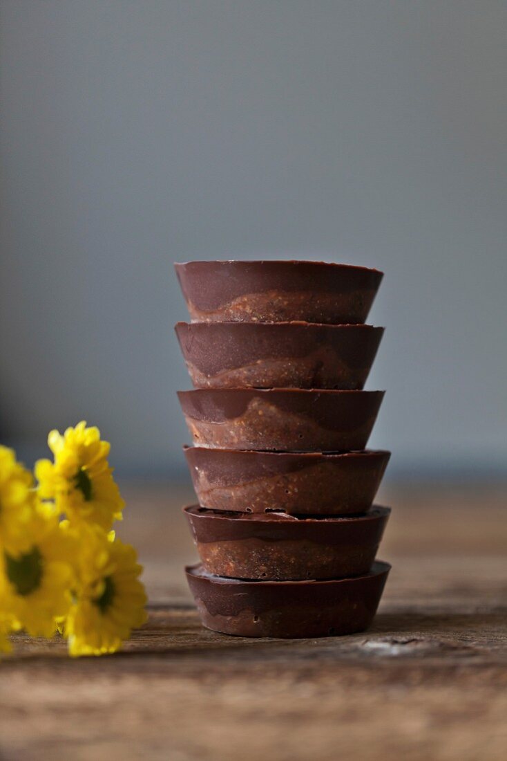 Stack of vegan date chocolate cups